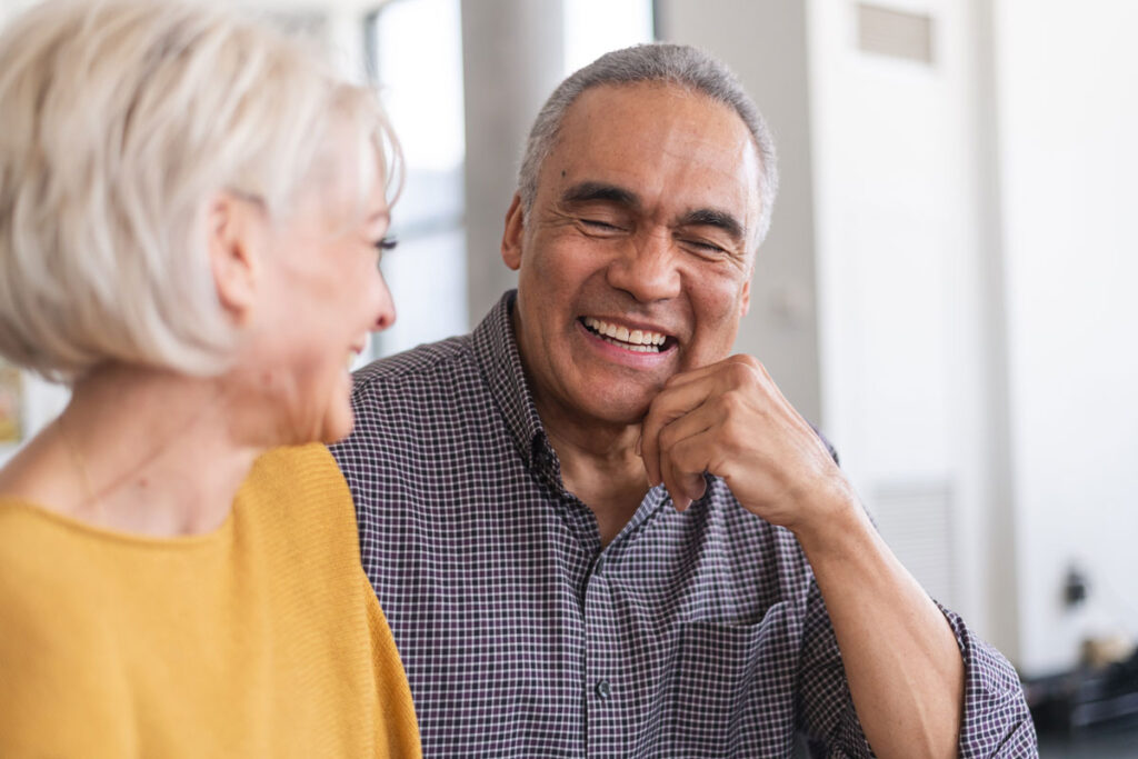 Senior couple laughing and talking